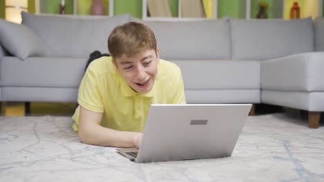 Young-man-chatting-on-laptop-at-home.
